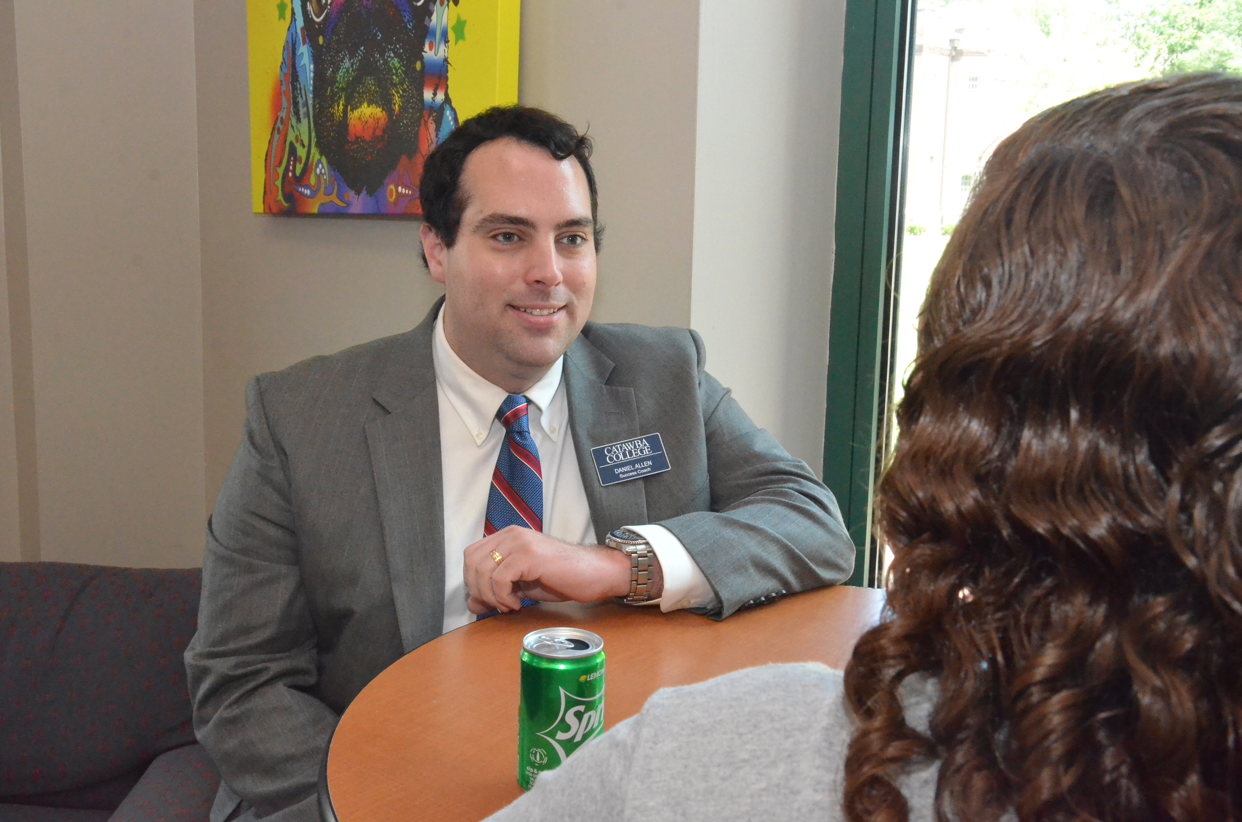 Success Coach Daniel Allen talks with student