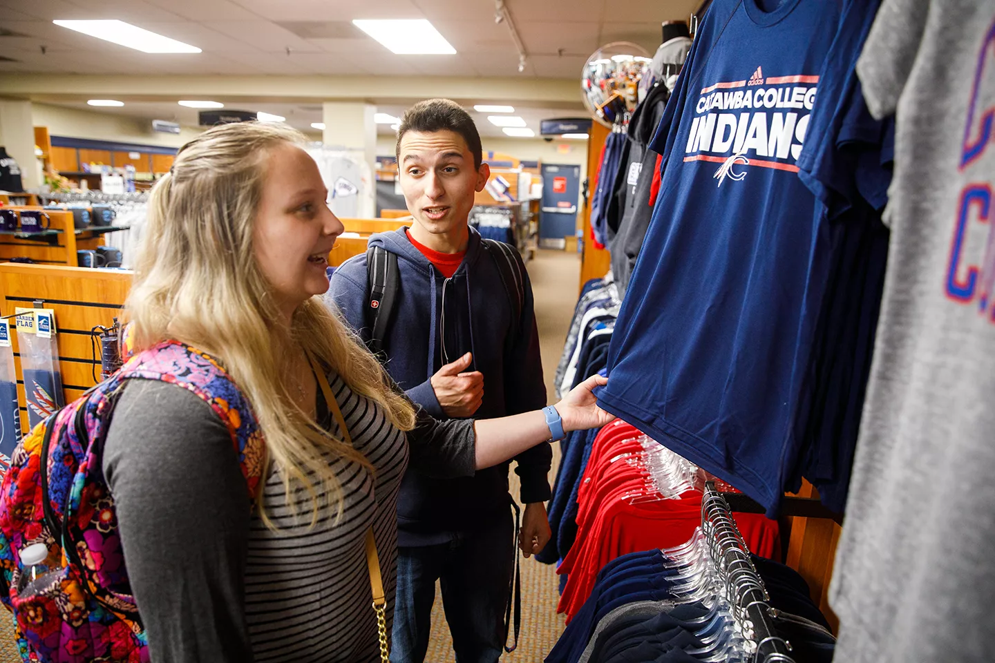 Students shopping shirts in the bookstore