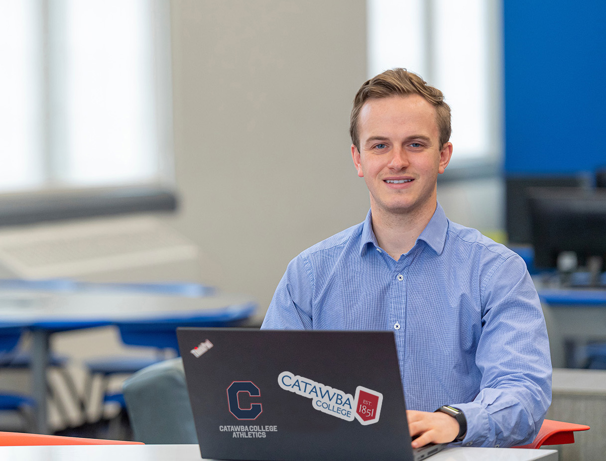 Student on laptop in library
